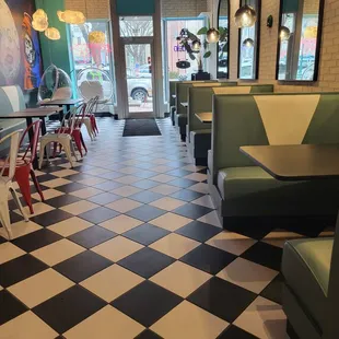 a checkered floor and booths