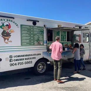 people ordering food from a food truck