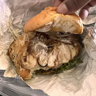 Still Not a Burger with grilled onions lettuce tomatoes Swiss cheese