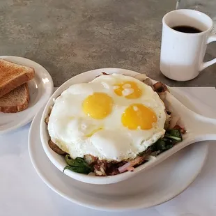 a bowl of eggs and toast