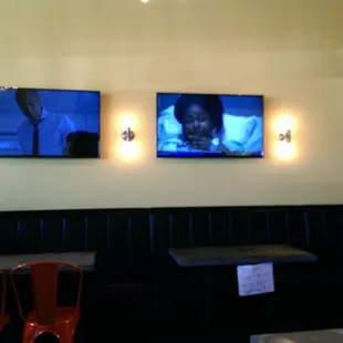 two televisions on the wall
