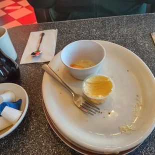 a plate of food and a cup of coffee