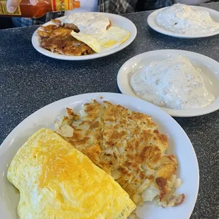 Bacon, Spinach, Tomato and Avocado Omelette, Grilled Potatoes, and Side of Biscuit and Gravy