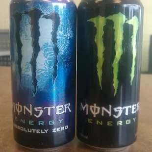 two monster energy drinks