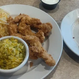 Chicken strips, broccoli cheese casserole, hash browns, and bacon