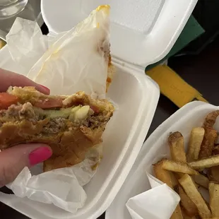 Chili Cheeseburger with pickles, tomatoes, onions