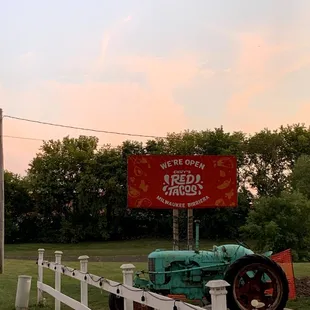 a tractor and a sign