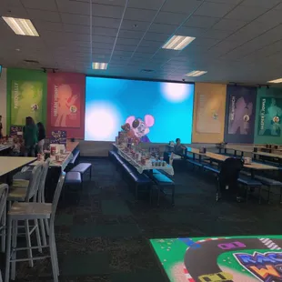 a restaurant with tables and chairs