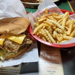 Ultimate Chicken Fried Chicken Sandwich with fries. Onion rings can be substituted for a small fed