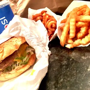 Double cheeseburger with crinkle and curly fries!