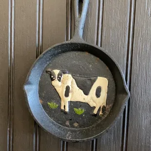 a cow on a frying pan