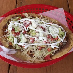 Huarache ( fried masa base, chicken, tomatoes, lettuce, &amp; green salsa )...