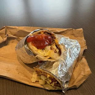 Ketchup, eggs, cheese, potatoes, bacon