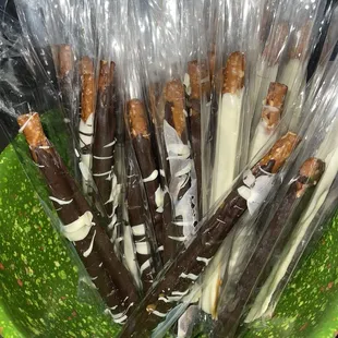 a green bowl filled with pretzels