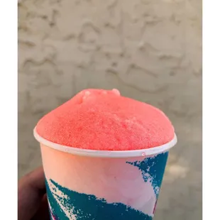 a hand holding a cup