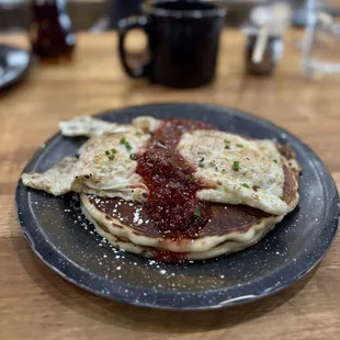 Short stack Good Ol&apos; Pancakes with berry compote and two eggs
