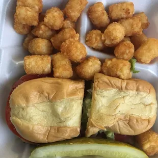 Half and Half Po Girl Ham n cheese and Po Boy cheeseburger with slaw on it.