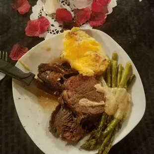 Prime rib, twice baked potatoes and asparagus in a cream base. Droooltastic.
