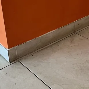 Dirty floor.  No excuse, as there were no customers.