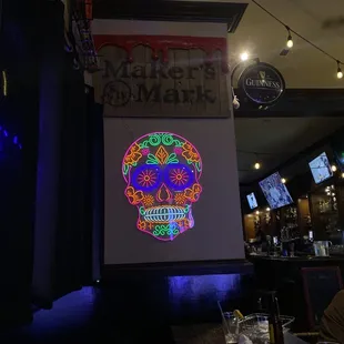 a neon skull on the wall