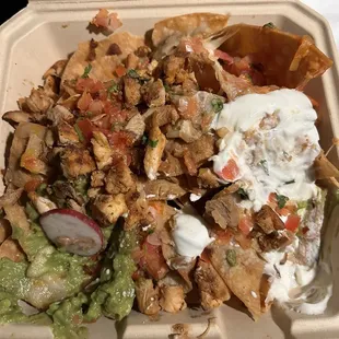 Nachos with grilled chicken breast.  Everything about this was perfect except the temperature, when it finally arrived. Not their fault