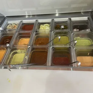 Salsa bar.  Pro tip.... They build in heat, from right to left.  The two on the far left side pack a punch but a really good.