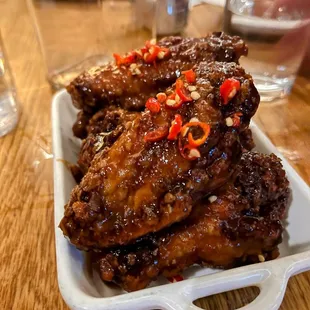 a plate of chicken wings on a table