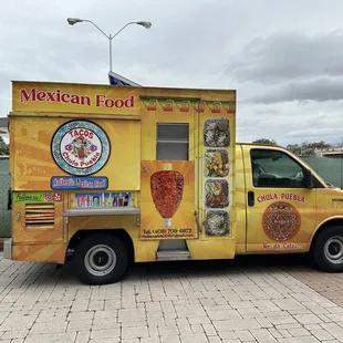 a mexican food truck parked in a parking lot