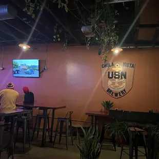 Indoors, big tables and TVs