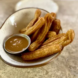 pumpkin spice churros with salted coconut-coffee caramel dip