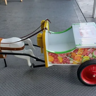 Cute horse &amp; carriage, in front of his store.