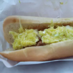 a hot dog with scrambled eggs