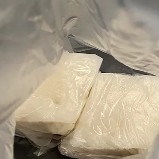 a piece of cheese wrapped in plastic