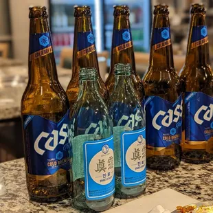 six bottles of beer on a counter