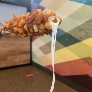 Potato Crusted HALF &amp;HALF Sausage. First half is just cheese with an EPIC cheese pull, second half is finally sausage.