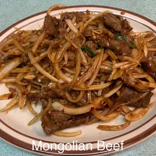 a plate of beef and noodles