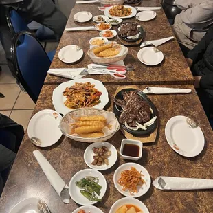 a long table with plates of food on it