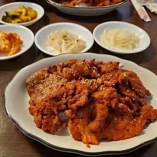 Lunch portion Spicy Pork Bulgogi. Bonchan: cucumber kimchi, cabbage kimchi, bean sprouts and pickled radish.