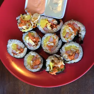 Korean roll (Kimbap): egg, rice, radish, cucumber, carrot comes with spicy mayo and wasabi sauce