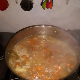 a pot of soup on a stove