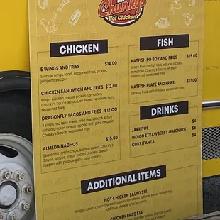 a menu on the side of a food truck