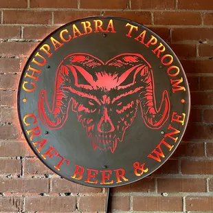 a sign on a brick wall