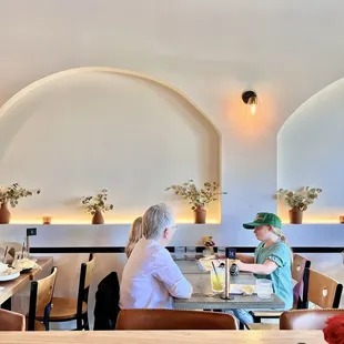 More seating. Love the plants placed throughout!