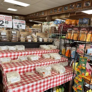 a checkered tablecloth and shelves of goods