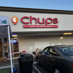 a car parked in front of a restaurant