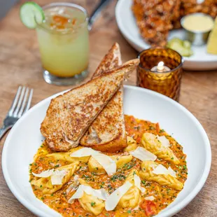 Handmade Braided Ravioli with garlic tomato sauce, capers, Parmesan