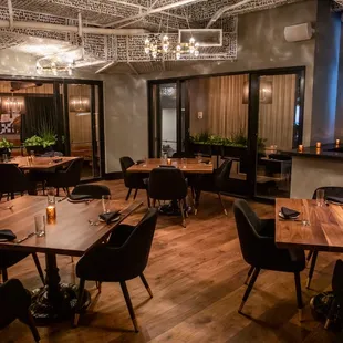 a dining room with tables and chairs