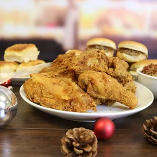 a plate of fried chicken and a bowl of coleslaw