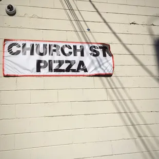 a sign on the side of a building