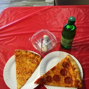 two slices of pepperoni pizza on paper plates